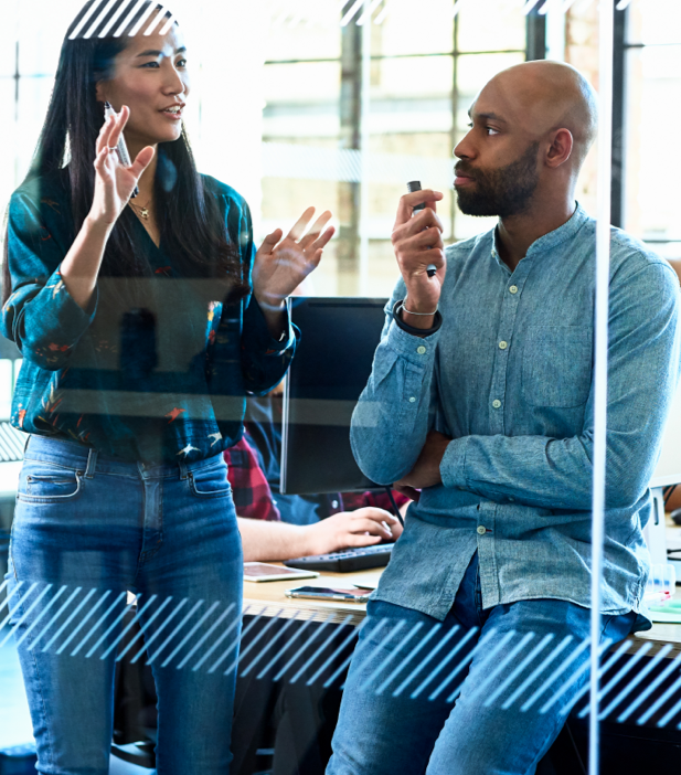 Resource Groups Image a woman gestures with her hands as she speaks with a colleague