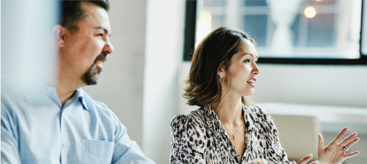 Two employees in a business meeting