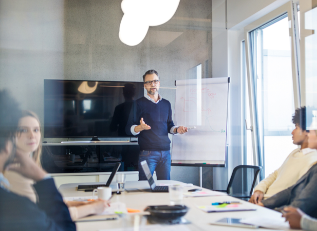 Employees sitting at a conference table during a training session